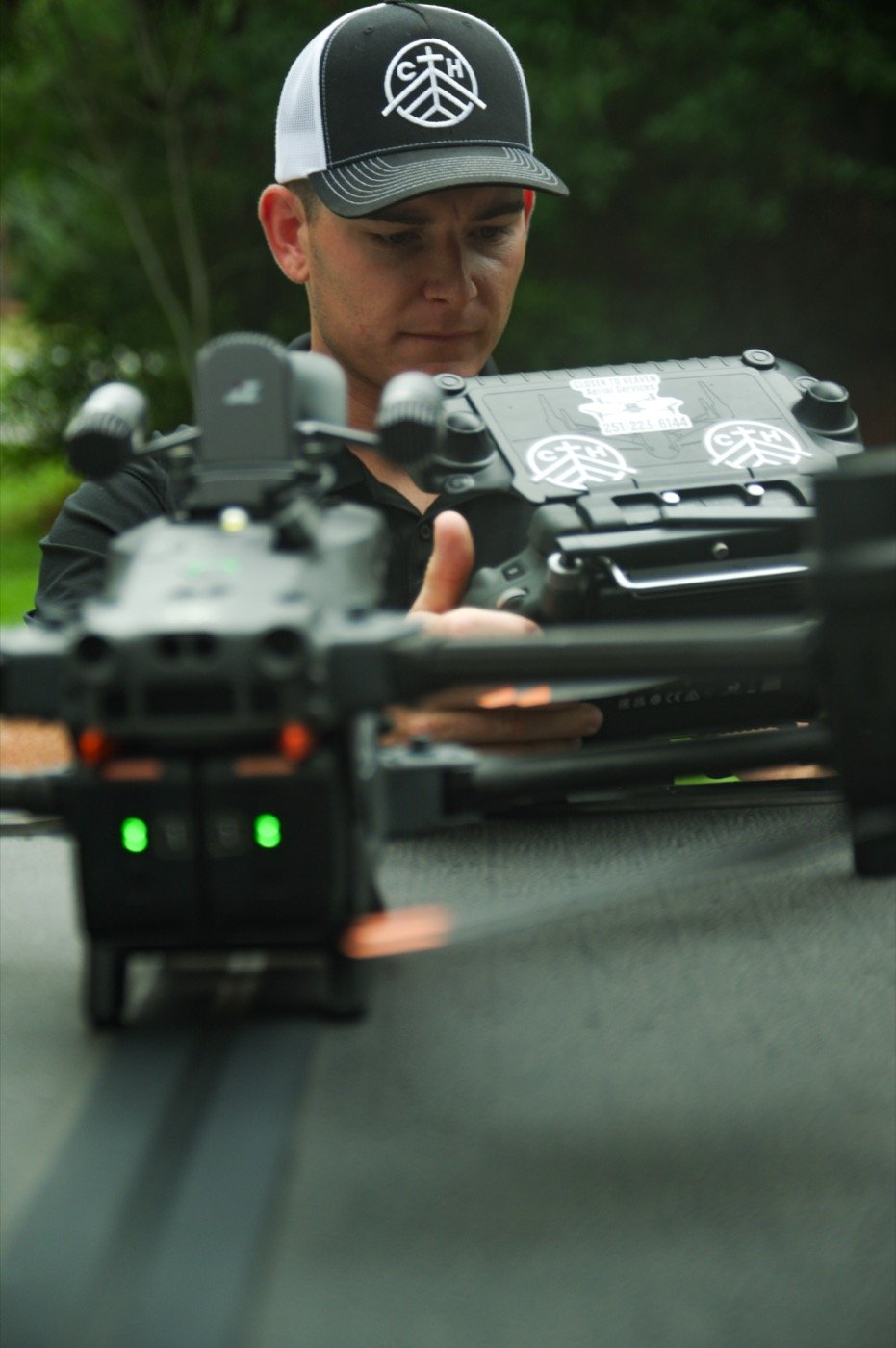 Brayden Biebricher, founder of Closer to Heaven LLC, preparing a drone